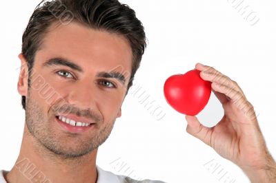 Portrait of a man holding a heart