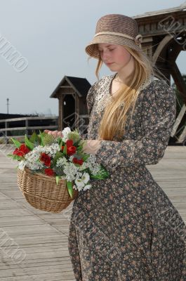 Girl with basket of flowers