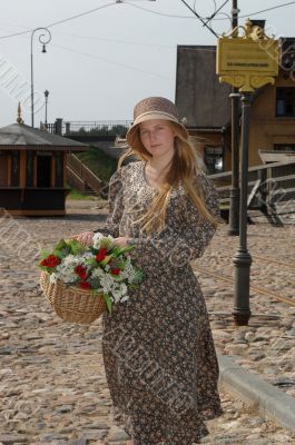 Girl with basket of flowers