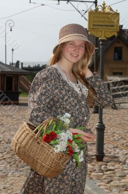 Girl with basket of flowers