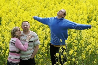 Three people in meadow