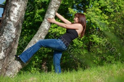 Young woman with tree.