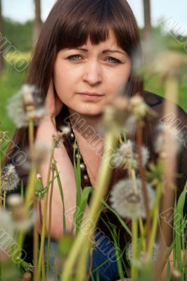 Portrait of beauty girl with dandelions.