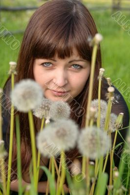Portrait of beauty girl with dandelions.