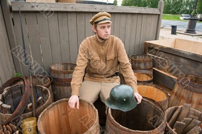 Retro style picture with soldier sitting on butt