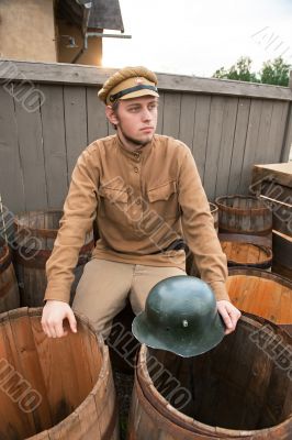 Retro style picture with soldier sitting on butt