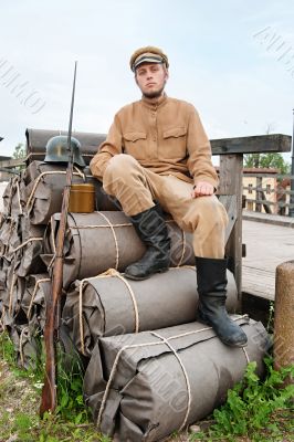 Picture with soldier sitting on the bundles