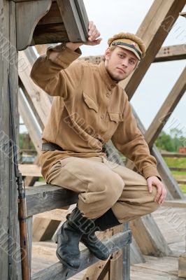 Picture with soldier sitting next to the sentry.