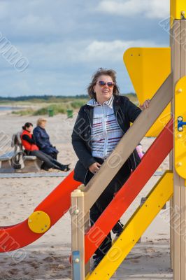 Woman relaxing in dune