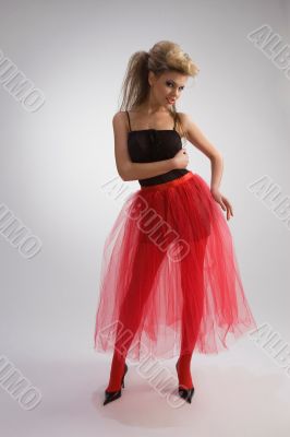 Beautiful girl in red skirt