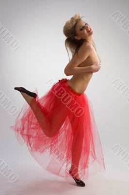 Dancing girl in red skirt