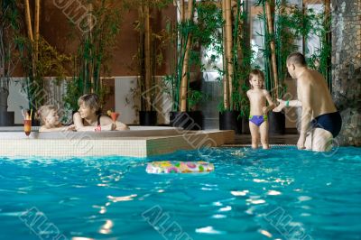 Family in swimming-pool