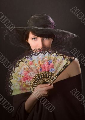   pretty woman with a  fan