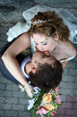 Bride and groom kissing