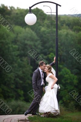 Bride and groom under lantern