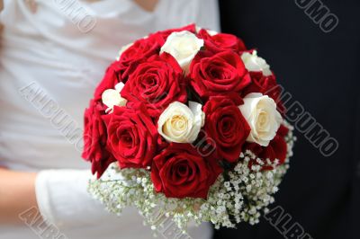 Hands with wedding bouquet 