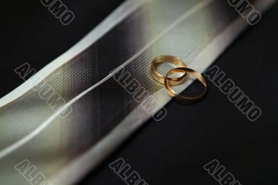Wedding rings on groom's scarf
