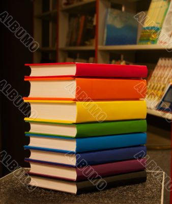 Pile of colorful books staying in the book shop