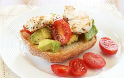 Tasty avocado, tomato and chicken bruschetta