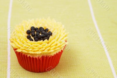 Vanilla cupcake with sunflower decoration