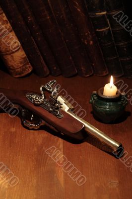 Old Pistol And Books