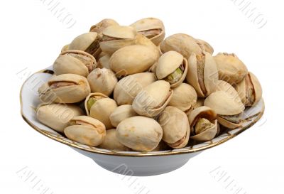 Pistachios on a plate, isolated