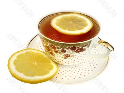 A cup of tea and slices of lemon