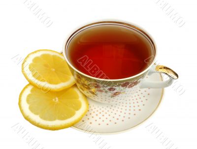 A cup of tea and slices of lemon