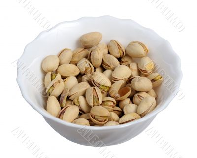 Pistachios on a plate, isolated