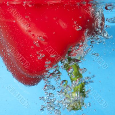 red pepper between bubbles 
