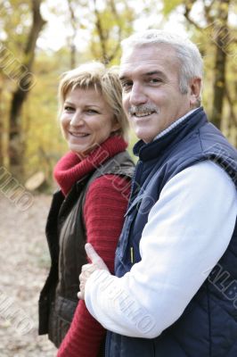 Couple walking through woods