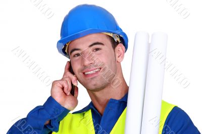 Construction worker talking on the phone