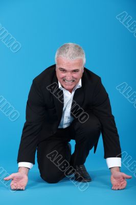Businessman attempting to lift
