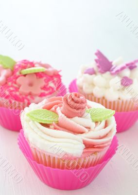 Vanilla cupcakes with various decorations
