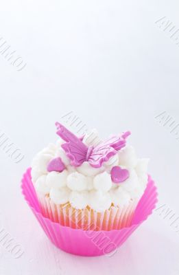 Vanilla cupcake with butterfly decorations