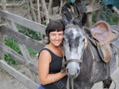Portrait happy smiling woman with horse