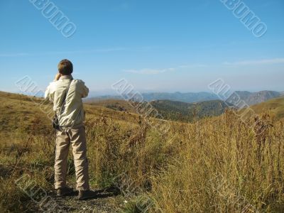 Man and caucasus mountains