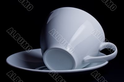 White cup lying on its side 