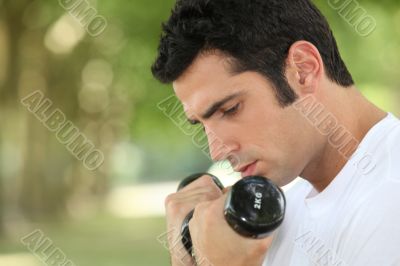 Man using hand weights