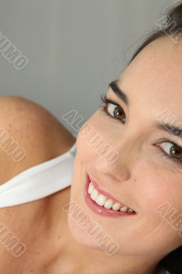 Closeup of a young woman smiling