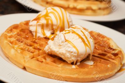 Belgian waffles with ice-cream and syrup