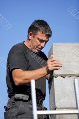 Construction worker building a wall