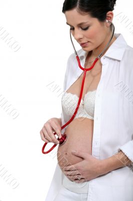 Pregnant woman with a stethoscope