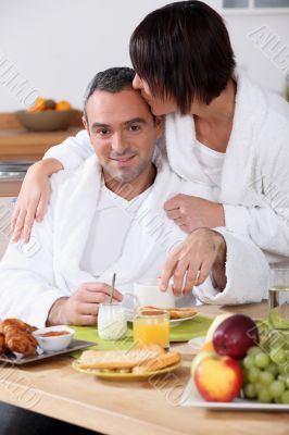 Couple eating breakfast together