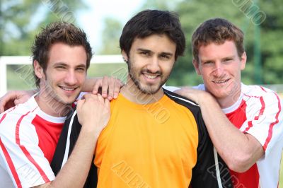 portrait of 3 football players