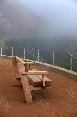 Wooden bench in a fog
