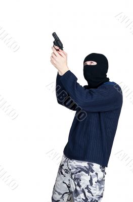 Masked man aims with gun