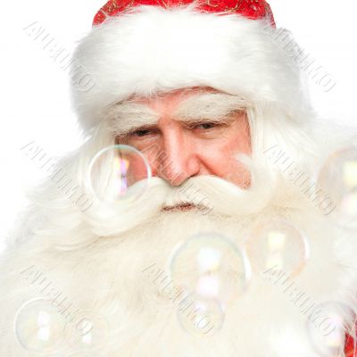 Santa Claus portrait smiling isolated over a white background an