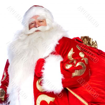 Santa Claus standing up on white background with his bag full of