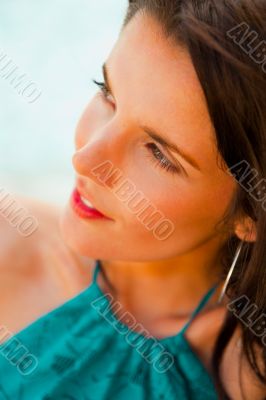 Pretty young woman with hot look and sexy smile sitting near poo